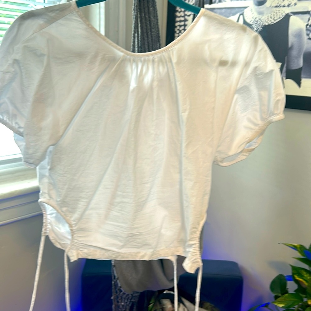 Cute white shirt ties on the sides made by Madewell